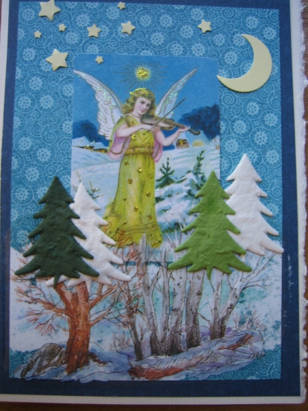 winter angel with violin in forest
