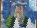 angel with lyre in sky with evergreens