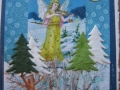 winter angel with violin in forest