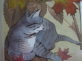 gray cat and autumn leaves