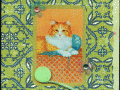 orange cat on green with yarn