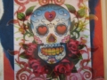 Skull with roses, red swirls