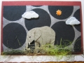 Young elephant with black circles, sun