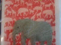 Adult elephant on red animal paper