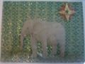 elephant on green glitter with red and gold star